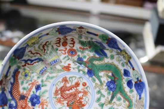 A Chinese wucai dragon and phoenix saucer dish, Kangxi mark, 19th century diameter 13.5cm